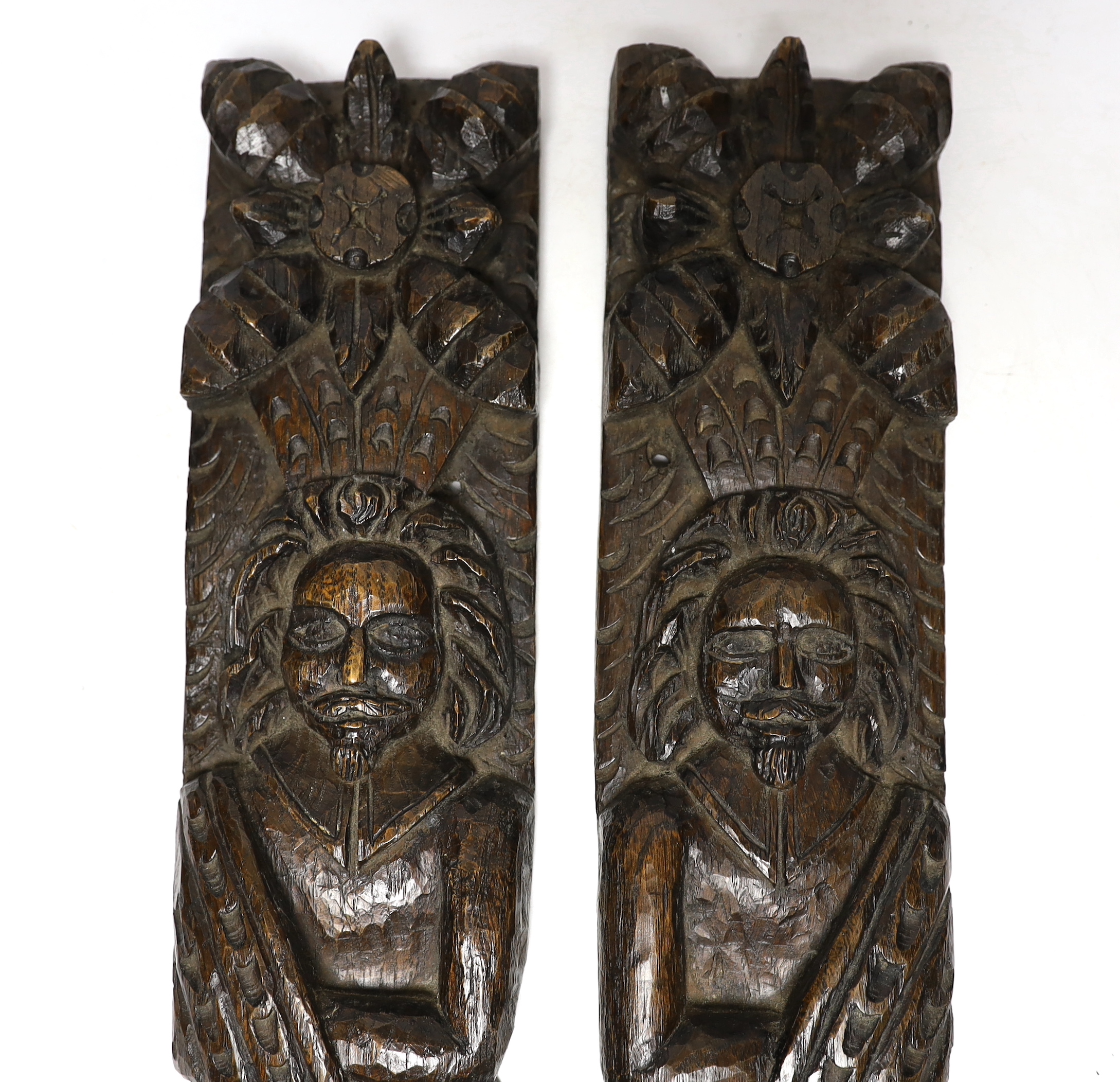 A pair of 17th century carved oak figural jambs, 43.5cm